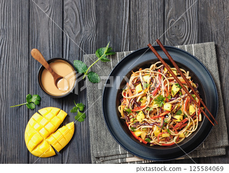 Thai Mango Noodle Veggie Salad in a bowl Thai Mango Noodle Veggie Salad in a bowl 125584069