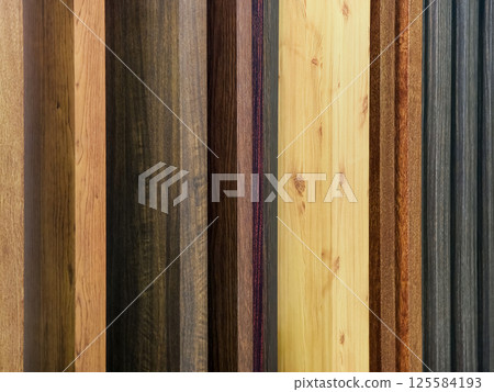 Various types of wooden planks displayed in a showroom for interior design projects Various types of wooden planks displayed in a showroom for interior design projects 125584193