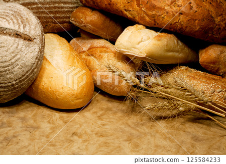 Fresh fragrant bread on the table Fresh fragrant bread on the table 125584233
