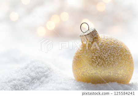 Christmas ball in snow 125584241