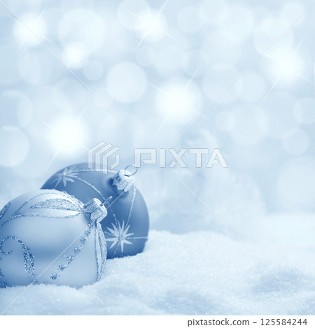 Christmas balls in snow 125584244