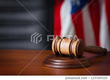 Wooden gavel on desk 125584320