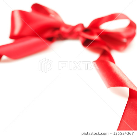 Red ribbon with bow 125584367
