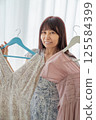 A woman choosing clothes 125584399