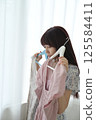 A woman choosing clothes 125584411