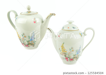 Set of Elegant vintage porcelain coffee pots isolated on white background. Set of Elegant vintage porcelain coffee pots isolated on white background. 125584504