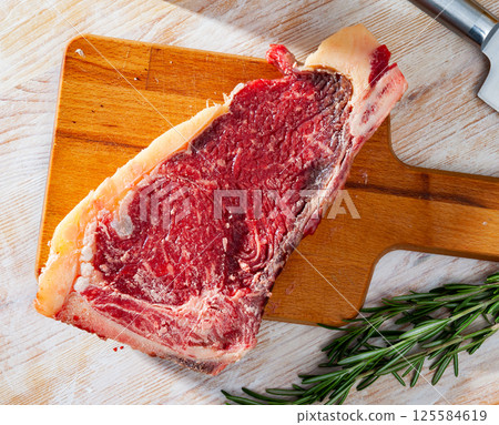 Raw entrecote with rosemary 125584619