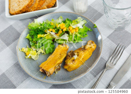 Roast chicken and mixed vegetable salad with canned corns 125584960