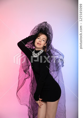 Bride in a black dress and veil Bride in a black dress and veil 125585099