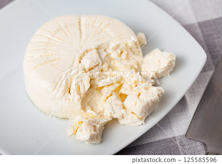 Fresh cottage cheese on plate Fresh cottage cheese on plate 125585596