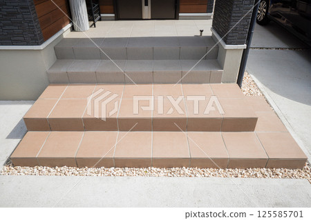 Residential image: Entrance approach: Brown tiles on replaced stairs 125585701