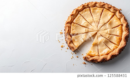 Freshly baked apple pie with a slice removed on textured white background 125588431