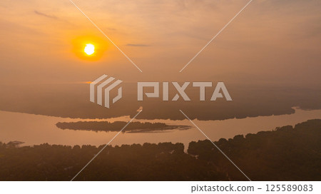 Aerial view of scenery sunrise over a river. 125589083