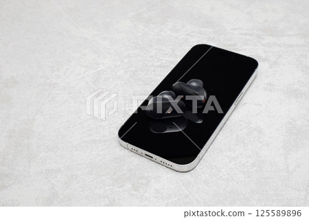 Earphones and smartphone 125589896