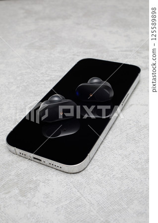 Earphones and smartphone 125589898