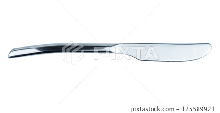 A sleek stainless steel knife resting on a clean white surface A sleek stainless steel knife resting on a clean white surface 125589921