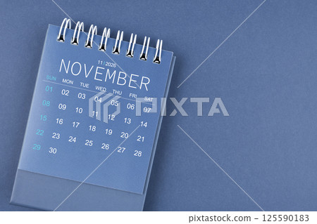 November 2026 calendar on blue background. Desk calendar for planning and organizing. 125590183