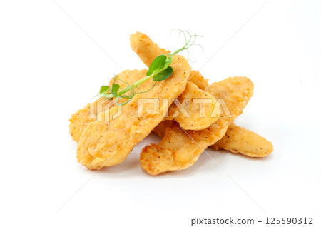 Crispy Chicken Strips with Fresh Microgreens 125590312