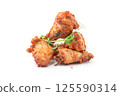 Golden Fried Chicken Wings with Fresh Microgreens 125590314