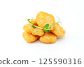 Crispy Chicken Nuggets with Fresh Microgreens 125590316