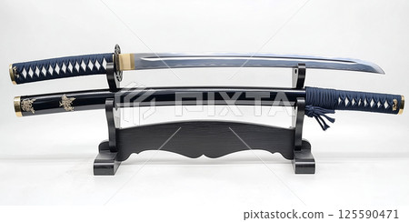 A full-length photo of a beautiful Japanese sword displayed on a pedestal (white background) 125590471