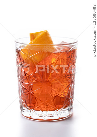 Americano cocktail garnished with twist orange isolated on white background Americano cocktail garnished with twist orange isolated on white background 125590498