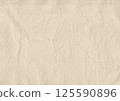 Vintage coffee-stained paper texture with soft wrinkles and aged edges. Perfect for scrapbooking, journaling, invitations, calligraphy, antique projects 125590896