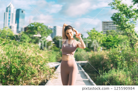 Southeast asian female stretching arm before exercise workout fitness woman wear sports outfit 125590984