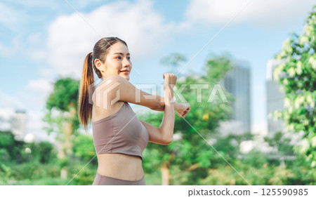 Southeast asian female stretching arm before exercise workout fitness woman wear sports outfit 125590985