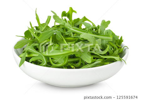 Heap of green fresh rucola or arugula leaf in ceramic bowl isolated on white background Heap of green fresh rucola or arugula leaf in ceramic bowl isolated on white background 125591674