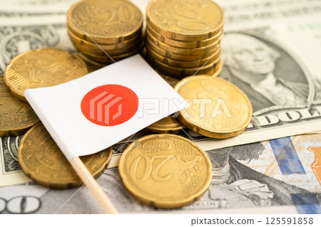 Japan flag on coin and banknote money, finance trading investment business currency. Japan flag on coin and banknote money, finance trading investment business currency. 125591858