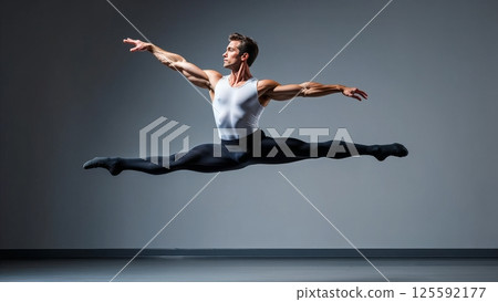 A split-second capture of a ballet dancer mid grand jete, his body horizontal to the floor in a perfect display of strength and weightlessness A split-second capture of a ballet dancer mid grand jete, his body horizontal to the floor in a perfect display of strength and weightlessness 125592177