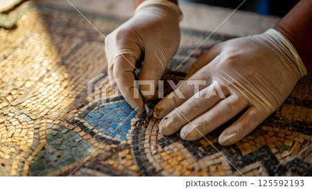 Roman Mosaic Artist Restoring Ancient Tilework in Pompeii, Fragile Heritage Conservation Roman Mosaic Artist Restoring Ancient Tilework in Pompeii, Fragile Heritage Conservation 125592193