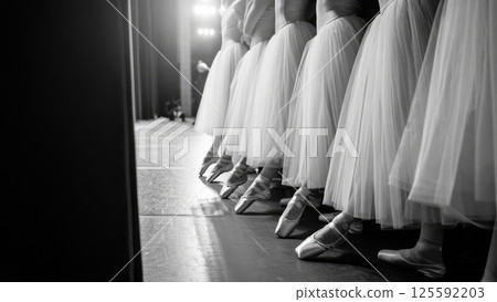 A dramatic black-and-white photo of a ballerina en pointe in an theater A dramatic black-and-white photo of a ballerina en pointe in an theater 125592203