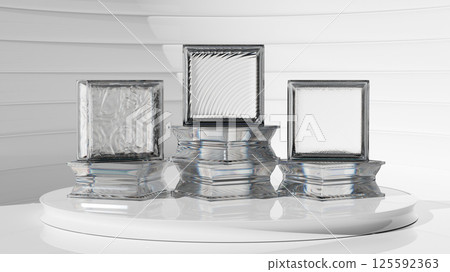 Group of transparent glass blocks against a white isolated background standing on a podium. Capturing abstract patterns and light distortion. Building assortment for home, bathroom and office. 125592363