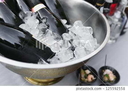 Champagne Bottles on Ice at a French Wedding Champagne Bottles on Ice at a French Wedding 125592558