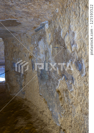Interior of a tholos tomb showing corbelled dome and columns in Carmona, Spain Interior of a tholos tomb showing corbelled dome and columns in Carmona, Spain 125593522