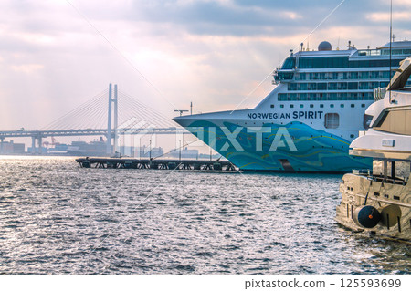 Yokohama cityscape in Japan with two luxury cruise ships, including the Norwegian Spirit and Queen Elizabeth Yokohama cityscape in Japan with two luxury cruise ships, including the Norwegian Spirit and Queen Elizabeth 125593699
