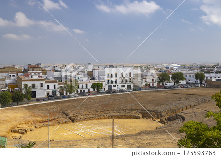 Roman Amphitheater Ruins Overlooking Carmona Town in Andalusia, Spain 125593763