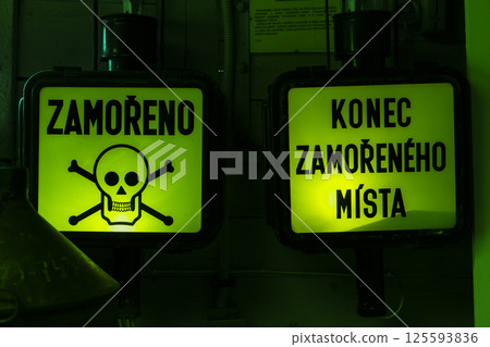 Contaminated area warning sign with skull and crossbones and end of contaminated area sign Contaminated area warning sign with skull and crossbones and end of contaminated area sign 125593836