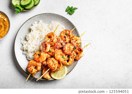 Grilled shimp prawn satay skewers with steamed rice Grilled shimp prawn satay skewers with steamed rice 125594051