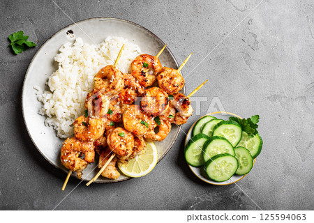 Grilled shimp prawn satay skewers with steamed rice Grilled shimp prawn satay skewers with steamed rice 125594063