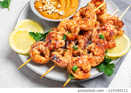 Grilled shrimp prawn satay skewers 125594111