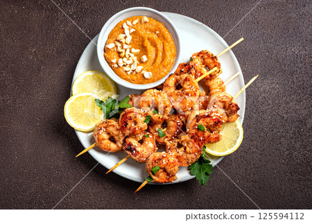Grilled shrimp prawn satay skewers 125594112