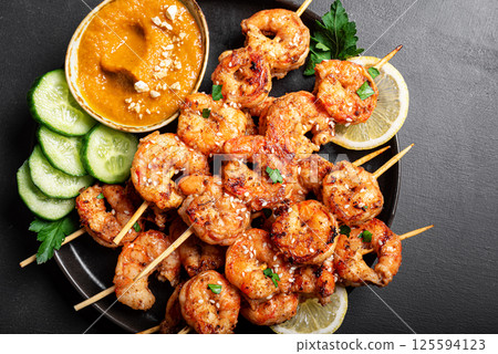 Grilled shimp prawn satay with spicy peanut sauce Grilled shimp prawn satay with spicy peanut sauce 125594123