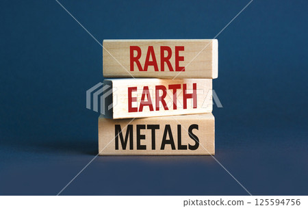 Rare earth metals symbol. Concept words Rare earth metals on beautiful wooden block. Beautiful grey table grey background. Business and rare earth metals concept. Copy space. 125594756