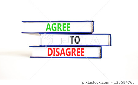 Agree to disagree symbol. Concept words Agree to disagree on beautiful books. Beautiful white paper background. Business and agree to disagree concept. Copy space. Agree to disagree symbol. Concept words Agree to disagree on beautiful books. Beautiful white paper background. Business and agree to disagree concept. Copy space. 125594763