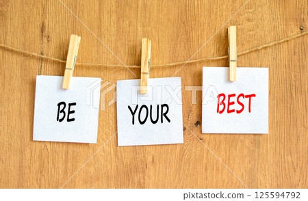 Motivational be your best symbol. Concept words Be your best on beautiful white paper on clothespin. Beautiful wooden background. Business motivational be your best concept. Copy space. Motivational be your best symbol. Concept words Be your best on beautiful white paper on clothespin. Beautiful wooden background. Business motivational be your best concept. Copy space. 125594792