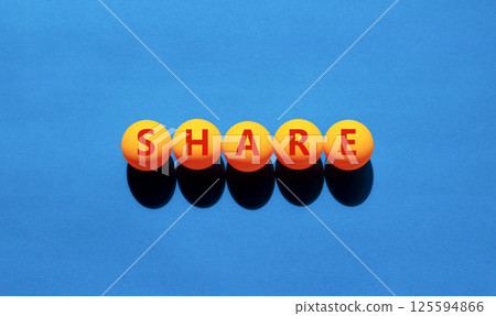 Share symbol. Concept word Share on beautiful yellow tennis ping pong balls. Beautiful wooden table wooden background. Business lifestyle share concept. Copy space. Share symbol. Concept word Share on beautiful yellow tennis ping pong balls. Beautiful wooden table wooden background. Business lifestyle share concept. Copy space. 125594866