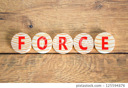 Force symbol. Concept word Force on beautiful wooden circles. Beautiful wooden table wooden background. Business lifestyle force concept. Copy space. 125594876